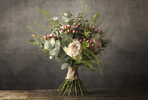 Image of Bouquet of flowers on a wooden table printed on Printed Glass Splashbacks